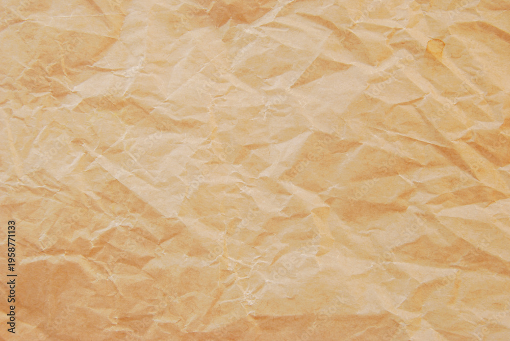 Obraz premium Crumpled fine brown kraft paper texture as background
