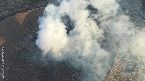 Smoking crater of mount bromo volcano aerial view