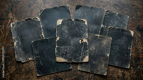 Vintage Tarot Cards Fanned Out on Dark Wooden Surface with Worn Edges