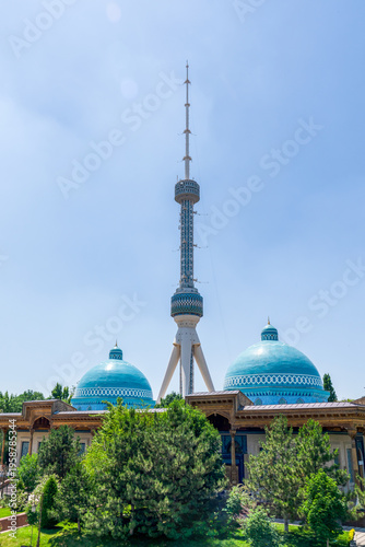 Vertical view of the Tashkent Television Tower standing behind the turquoise tiled domes of the Museum of Victims of Political Repression, Tashkent (Toshkent), Uzbekistan (O'zbekiston)