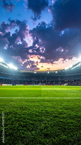Stadium at twilight with a vibrant green field beneath a dramatic sky