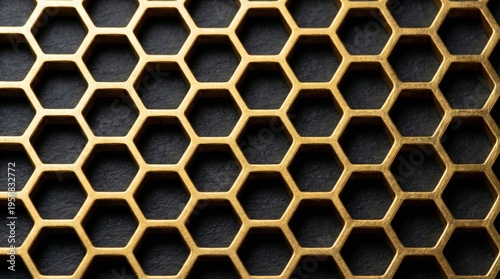 Seamless hexagonal honeycomb pattern in metallic gold on dark background.
