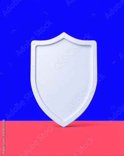 A minimalist white shield stands against a vibrant blue background and red surface, symbolizing protection and security.