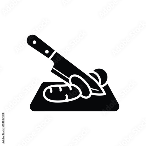 Knife cutting bread and vegetables on cutting board showing food preparation and slicing process for cooking or serving meals with kitchen tools and chopping action