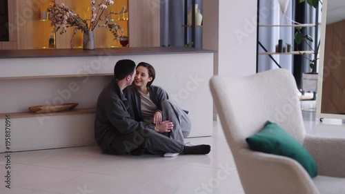 Couple enjoys quiet moment together in modern, stylish interior space