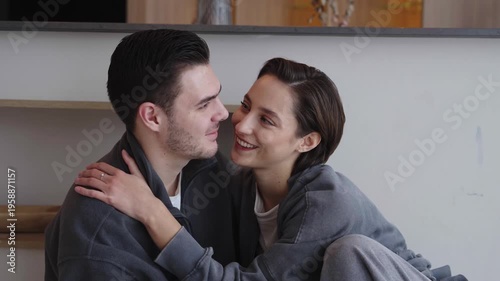 Couple shares a tender moment in a cozy home setting