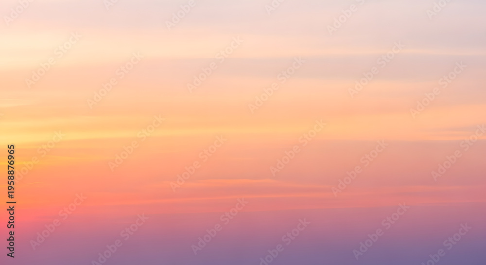 Fototapeta premium A serene sky with soft pastel colors transitioning from warm orange and pink to cool purple, perfect for a seamless background