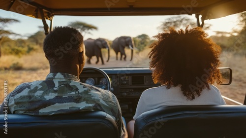 Couple on Safari Observing Elephants in African Savannah.