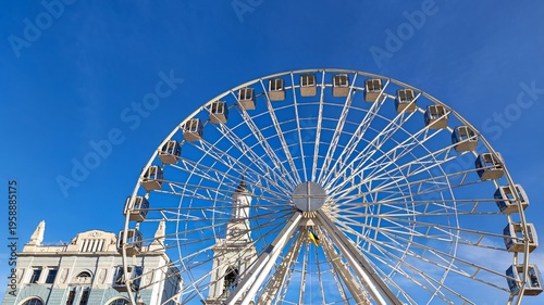 Ferris wheel with copy space and city background in Kyiv