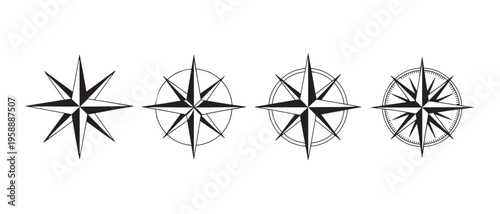 A collection of four stylized compass rose designs, showcasing navigational direction and orientation.