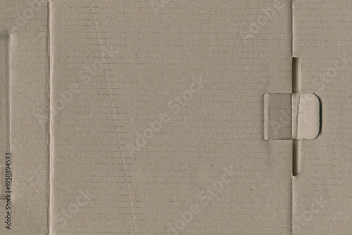 Flat brown Cardboard texture background with a small folded side flap