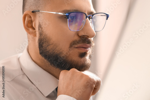 Male trader in eyeglasses w...