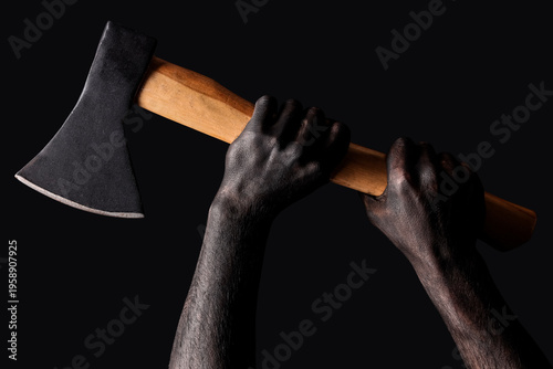 Hands in black paint holdin...