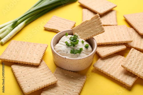 Tasty crackers with bowl of...