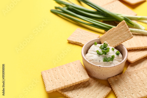 Tasty crackers with bowl of...
