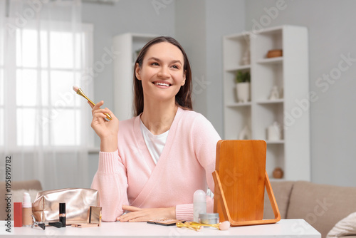 Young woman with cosmetic b...