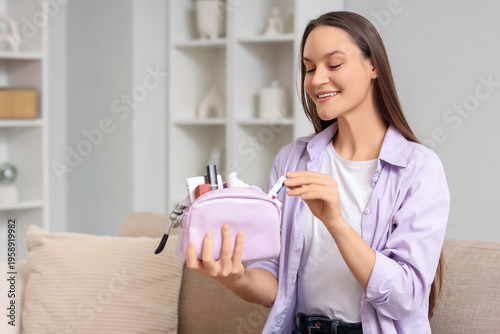 Young woman with cosmetic b...