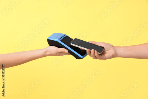 Hand of customer paying wit...
