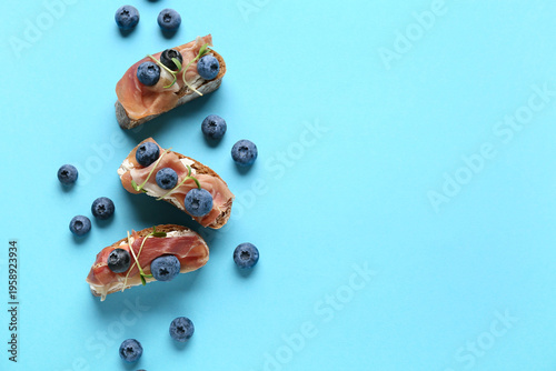 Tasty canapes with jamon, c...