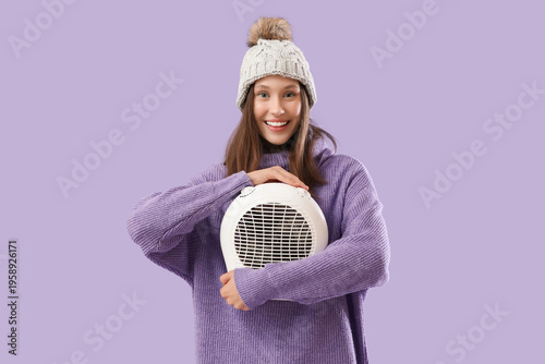 Smiling young woman in warm...
