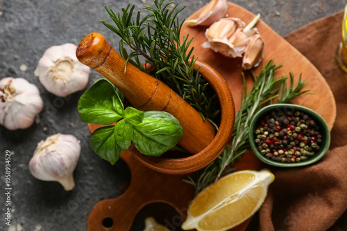 Wooden mortar with basil le...