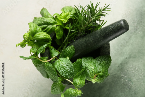 Mortar with basil leaves, m...