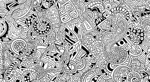 Intricate black and white seamless pattern with hand-drawn abstract doodles and complex geometric organic shapes for decorative background design