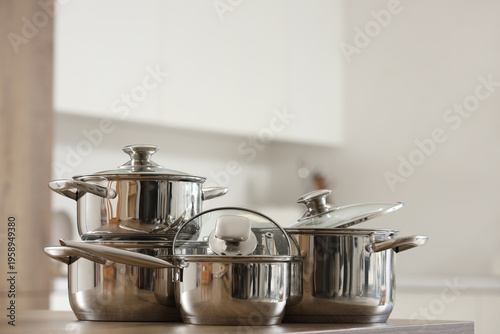 Stainless cooking pots on w...