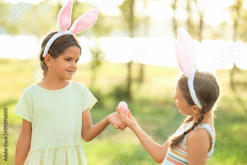 Cute little girls with bunn...