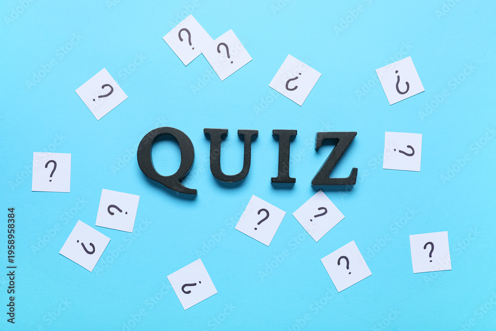 Fototapeta premium Word QUIZ with many question marks on blue background