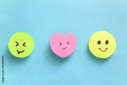 Sticky notes with smiley fa...