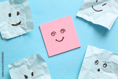 Crumpled sticky papers with...