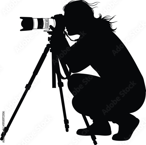 Detailed Silhouette of a Professional Female Photographer Crouching and Taking Pictures with a DSLR Camera on a Tripod Isolated on a Solid White Background