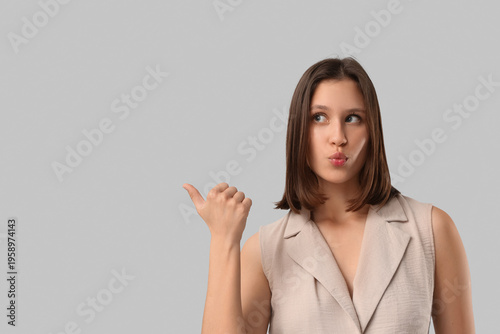Beautiful young woman in st...