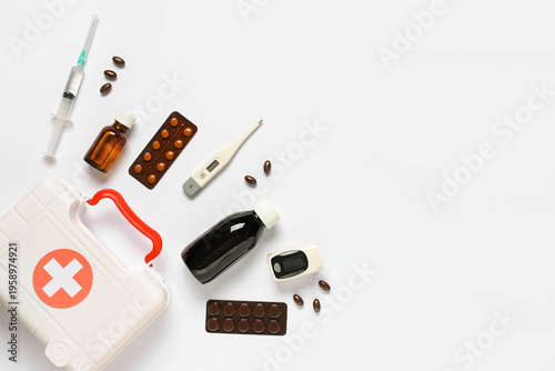 First aid kit with pills, t...