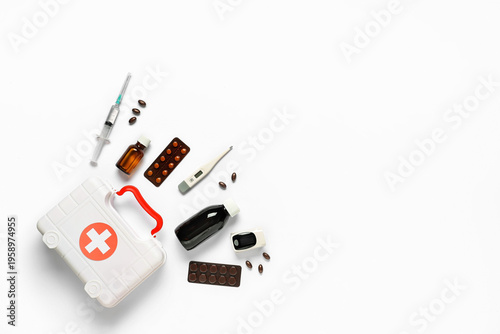 First aid kit with pills, t...
