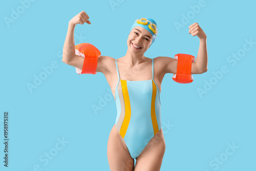 Young happy female swimmer ...
