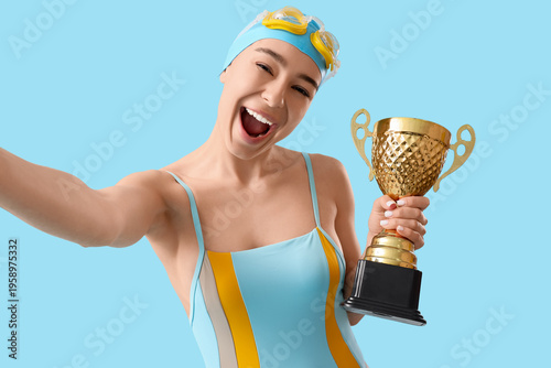 Young happy female swimmer ...