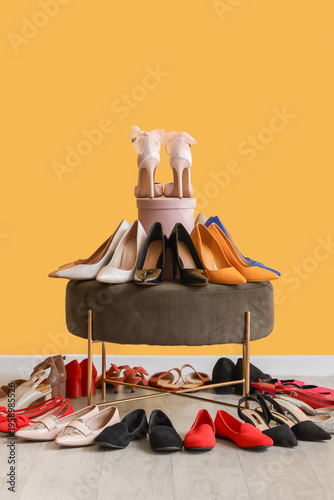 Pouf with women's shoes nea...