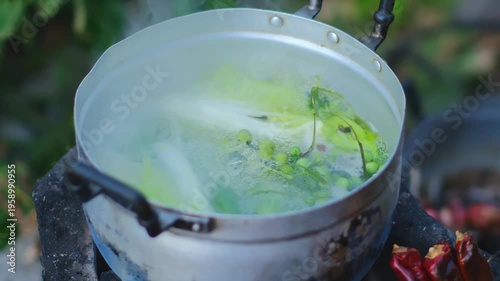 Fresh Vegetables Boiling in a Pot with Steam Rising on a Natural Background in a Rustic Cooking Scene for Culinary Inspiration