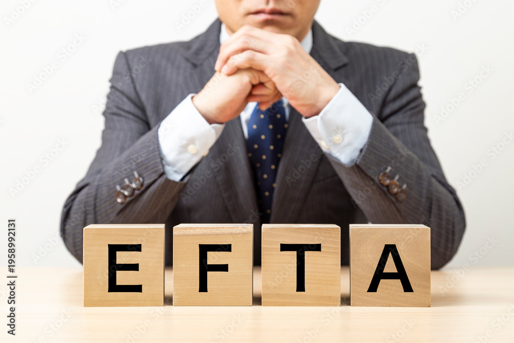 Obraz premium 「EFTA」と書かれたブロックとビジネスマン