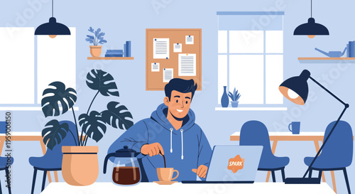 Young man working on laptop in modern office space.