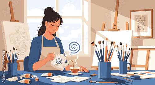 Young woman artist pouring tea at her art studio desk.
