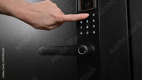 A woman opens a modern smart door lock with a digital keypad using a code.