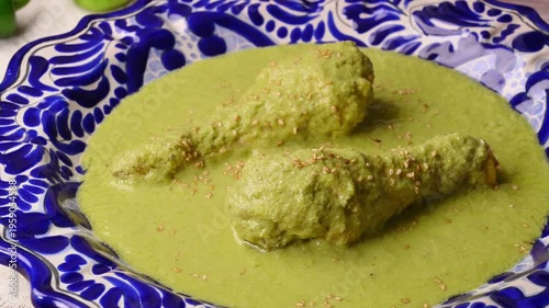 Authentic Mexican food, green seed mole or pipian with chicken and sesame seeds