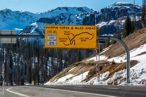 Wolf Creek Pass Hairpin Curve Warning Sign on a Sunny Winter Day
