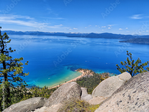 Breathtaking blue lake stretches to distant mountain peaks