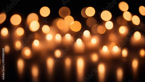 Photos Glowing golden bokeh lights reflecting on a dark surface, creating a magical festive atmosphere