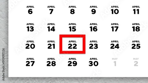 The date April 22nd marked with a red cursor on the wall calendar 2026