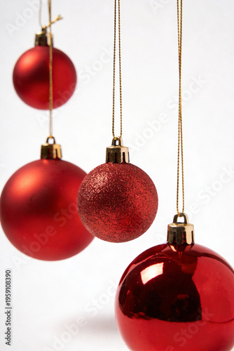 Set of Multiple Hanging Red Christmas Baubles on White Background